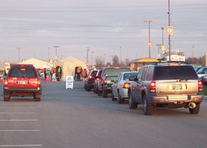 Cars line up in front of the DRASH H1N1 drive-thru vaccination clinic in Madison County, IN.